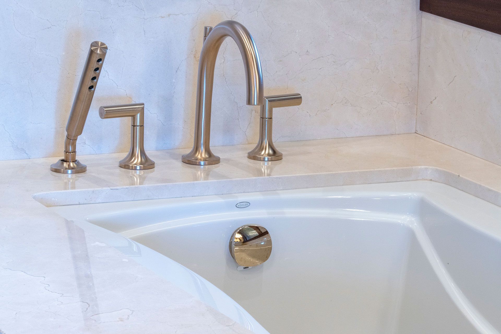 A bathtub with a faucet and a shower head