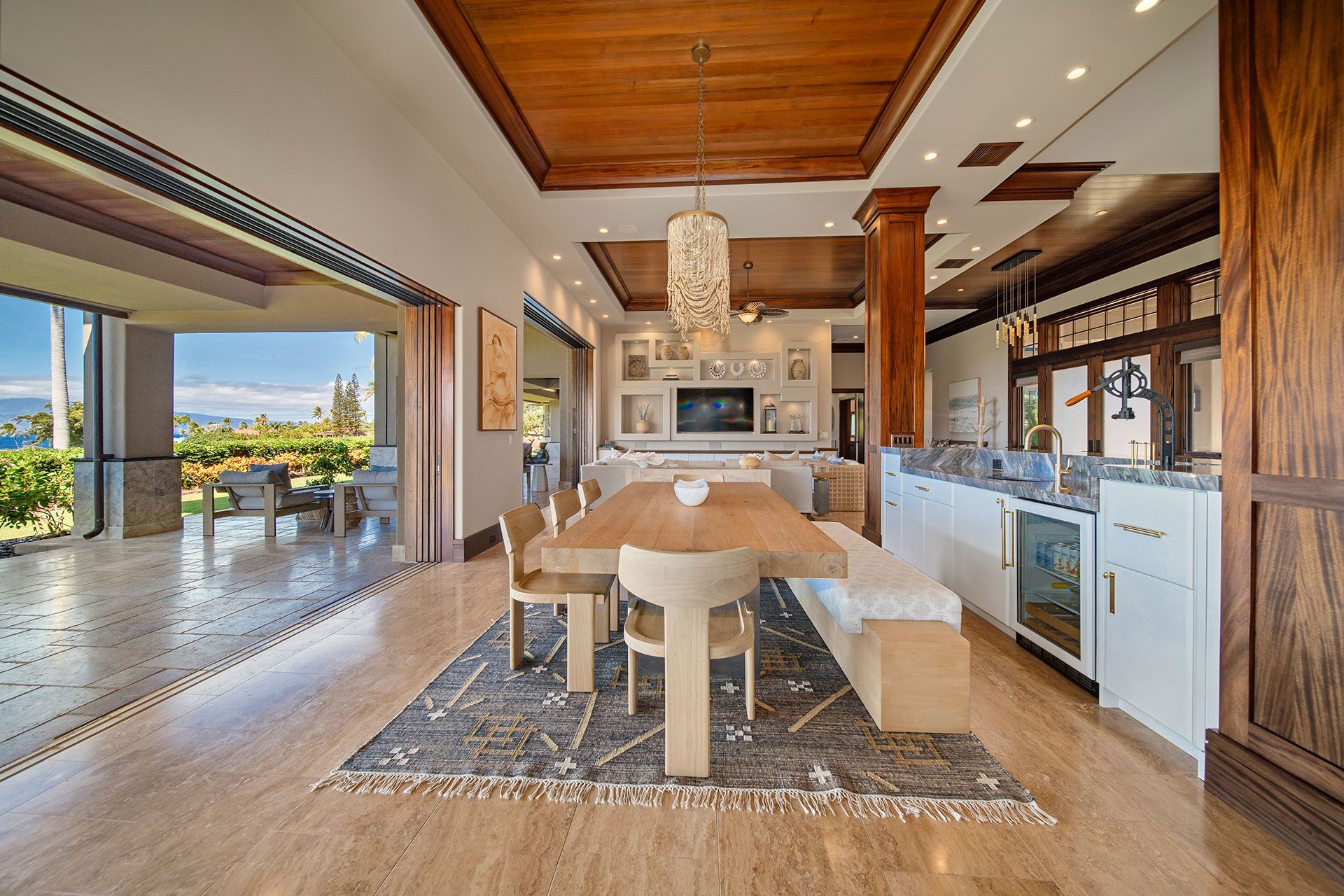 A large dining room with a wooden table and chairs