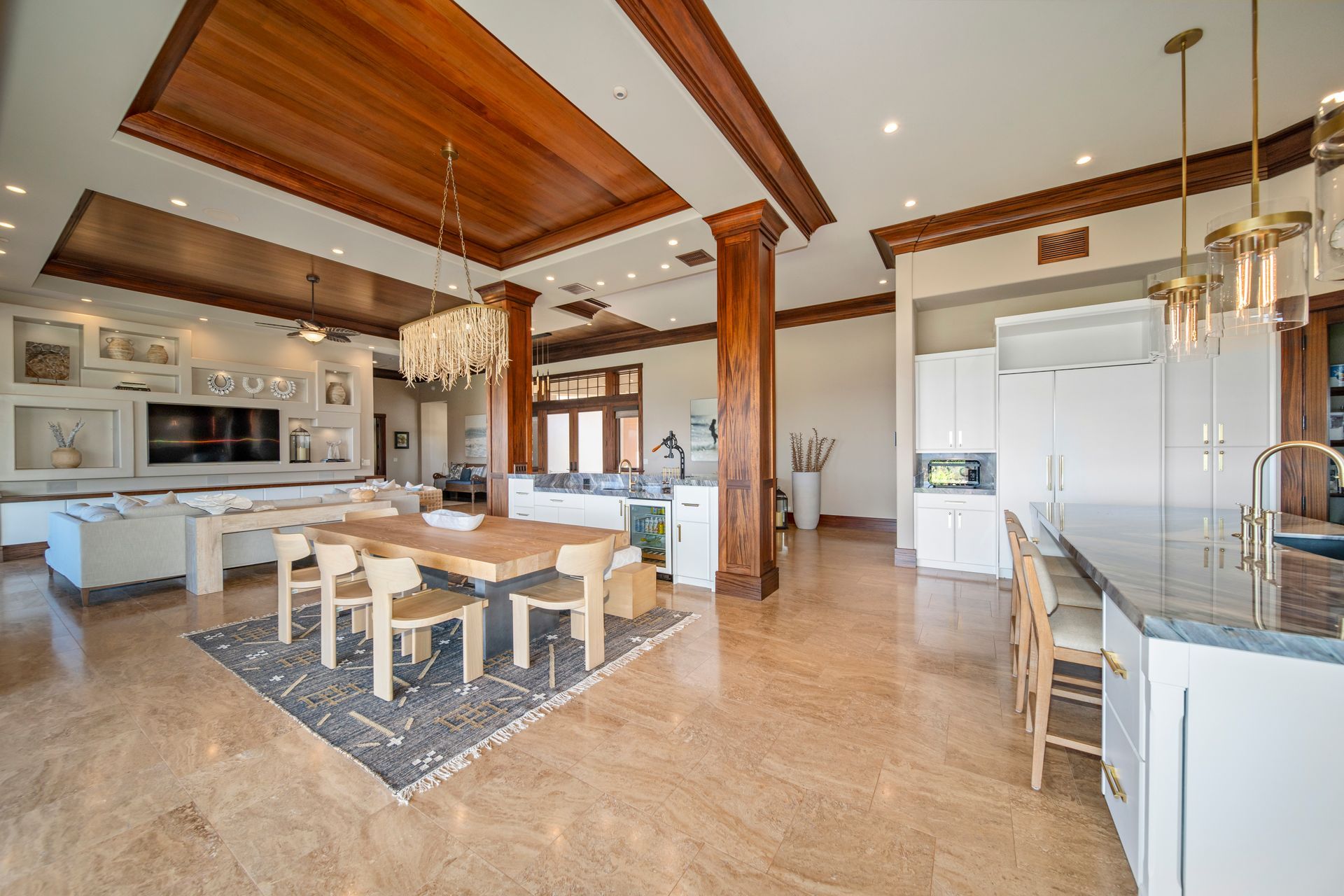 There is a table and chairs in the middle of the room.