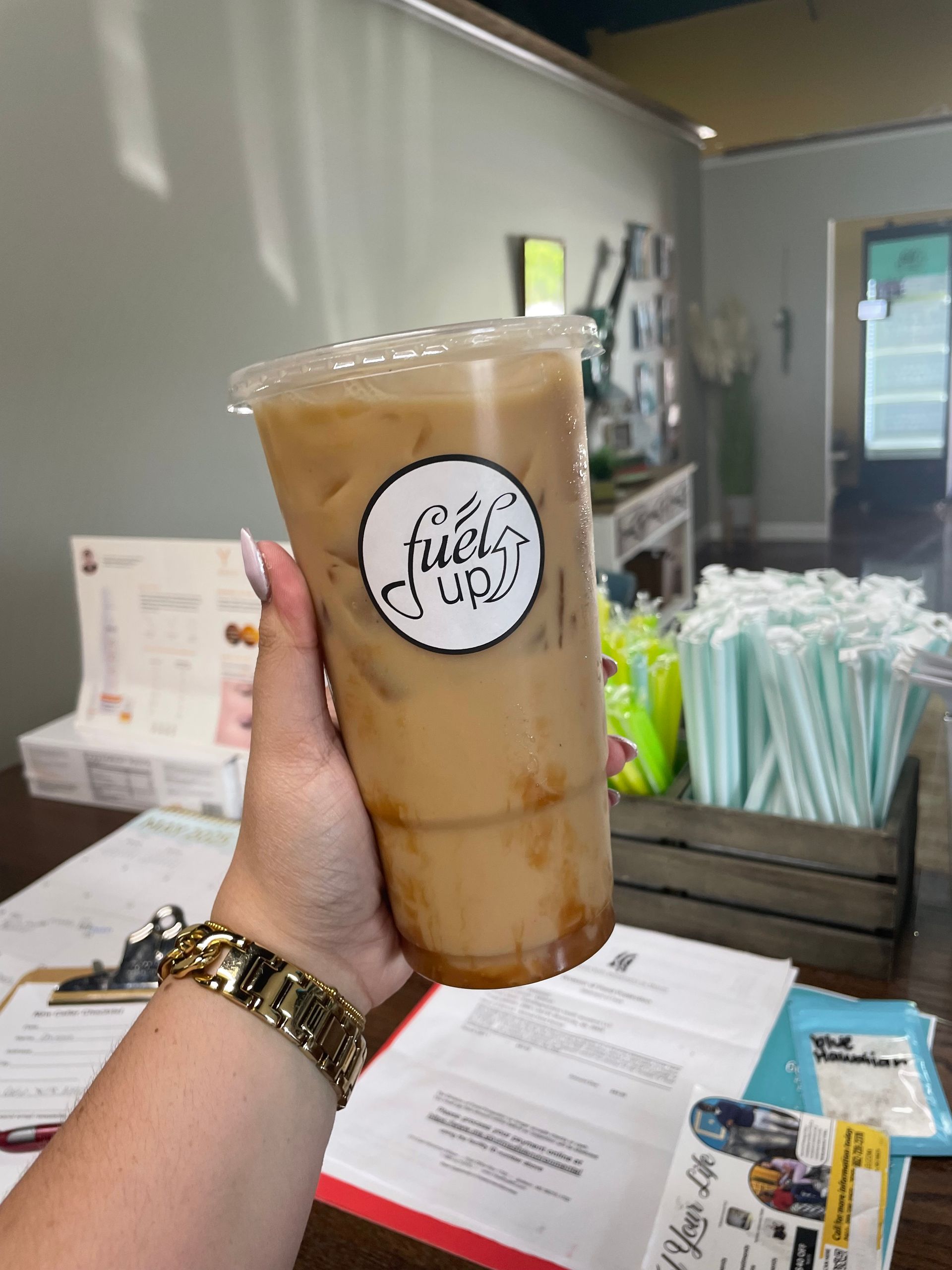 A person is holding a cup of coffee in their hand.