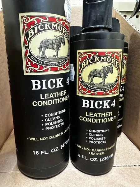Two Black Rock leather conditioner bottles, one large and one small, with white labels and red accents