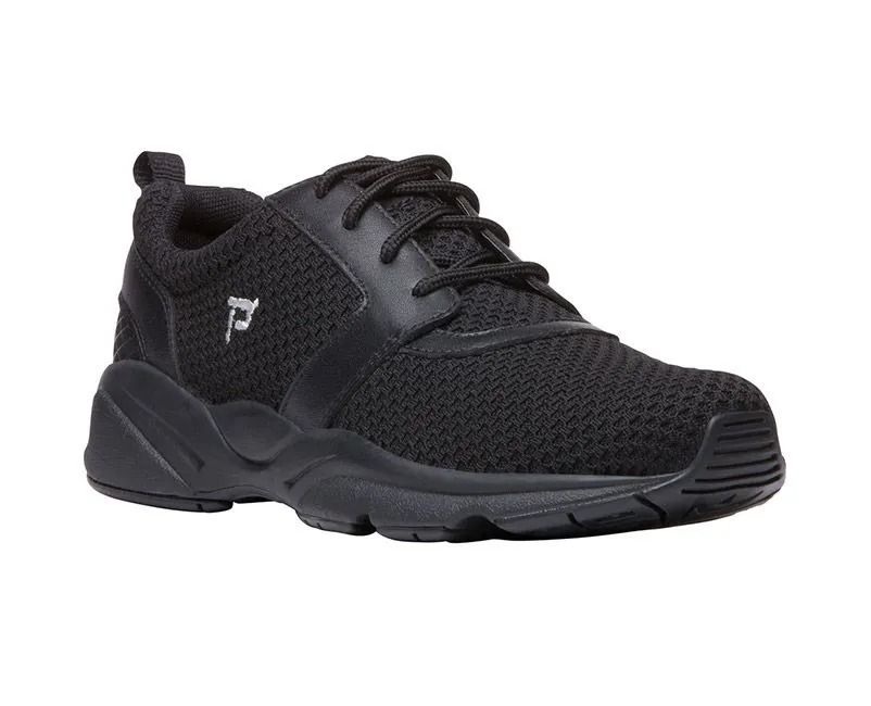 Black athletic sneaker with mesh upper and thick sole, shown on a white background
