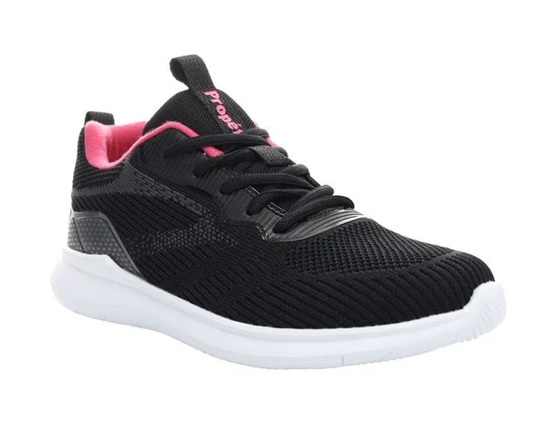 Black athletic sneaker with pink accents and white sole on a white background