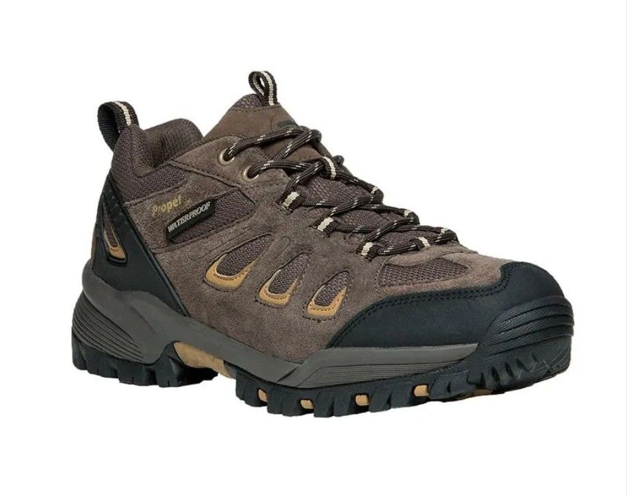 Brown and black rugged hiking boot with laces and thick tread sole