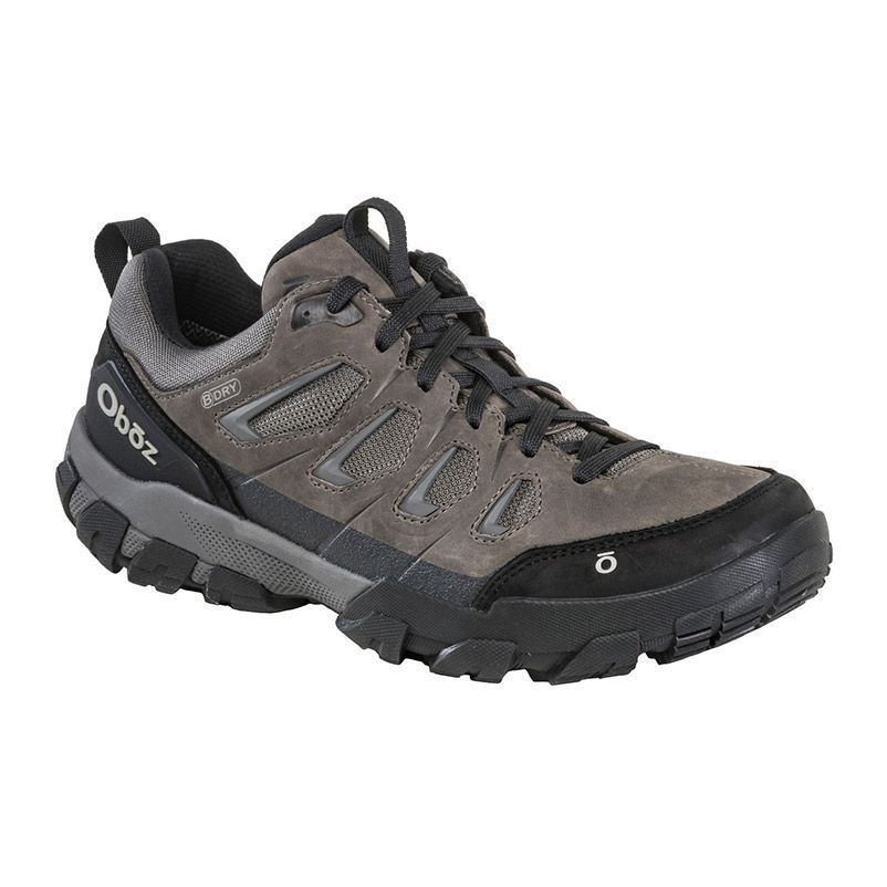 Gray and black hiking shoe with rugged sole, shown in side view on a white background