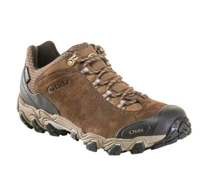 Brown hiking shoe with black toe cap and tan laces, shown on a white background