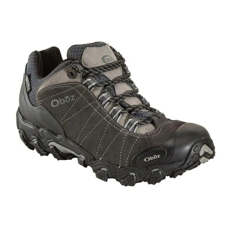 Black and gray hiking shoe with rugged tread and laced upper