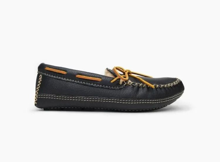 Black moccasin shoe with tan laces and stitching, shown in side profile on a white background