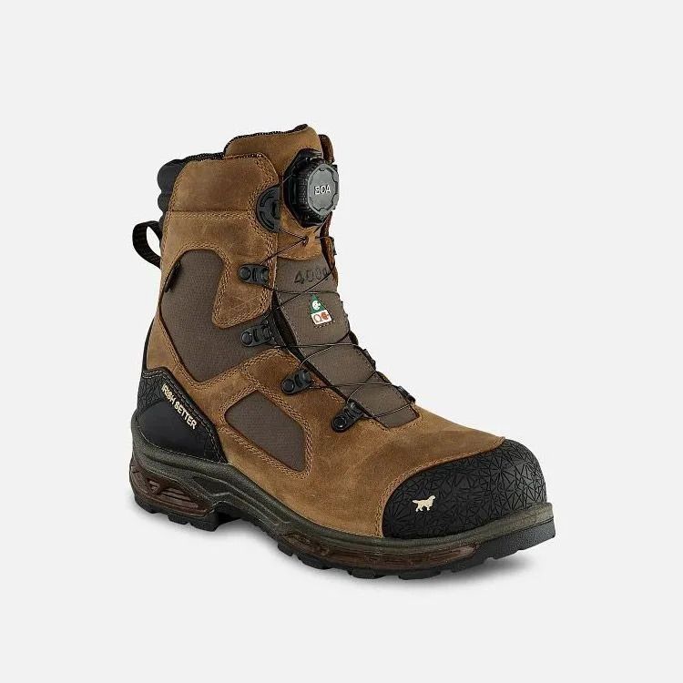 Brown and black hiking boot with lace-up closure and a round dial on the tongue, isolated on white background