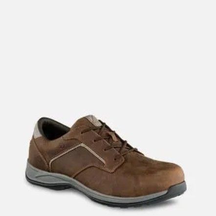 Brown leather dress shoe with black sole on a white background
