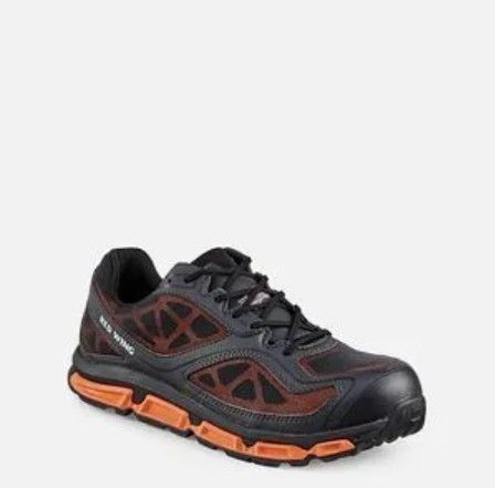 Black and orange trail running shoe on a white background