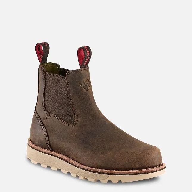Brown leather Chelsea boot with red pull tabs and a light sole on a white background