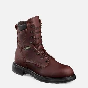 Brown leather lace-up work boot with black sole on a white background