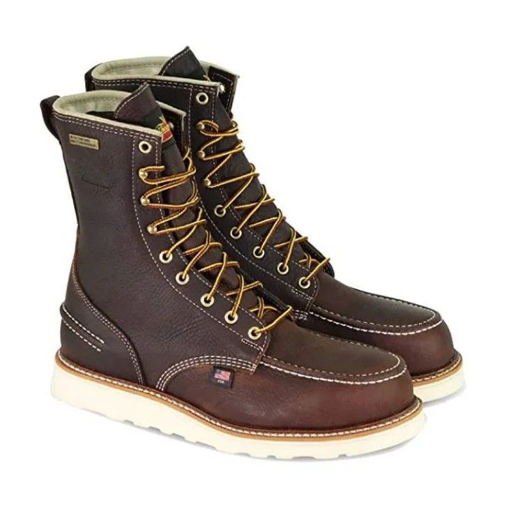 Brown leather lace-up boots with yellow laces and white soles, shown side by side on a white background