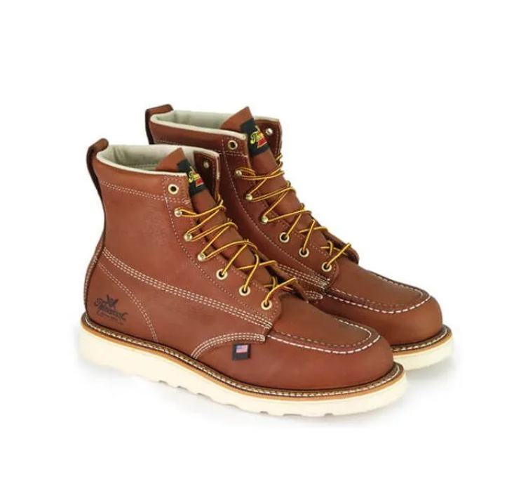 Brown leather lace-up work boots with tan soles, shown pair on a white background