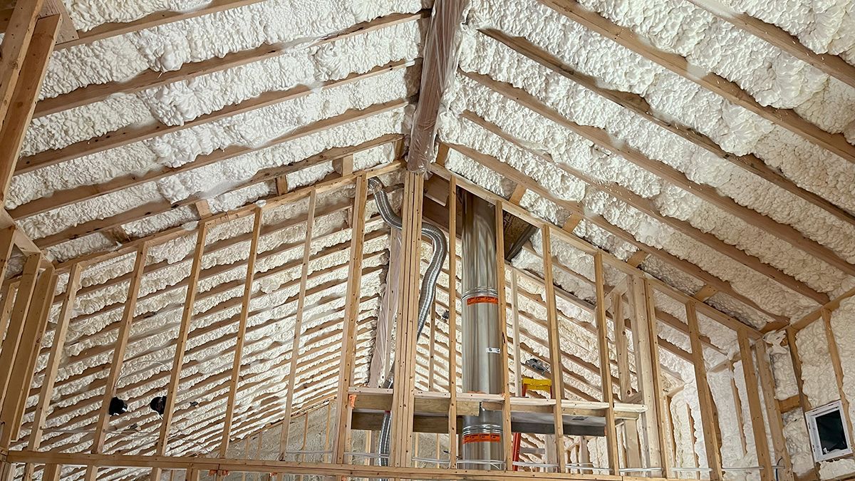 A house is being built with a lot of insulation on the ceiling.