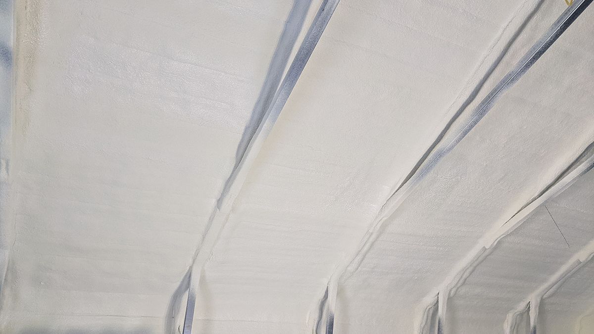 A close up of a white ceiling with a few lines on it.