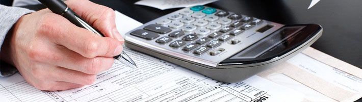 Man filling the Income Tax Return form