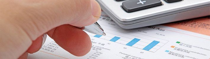 Businessman's hand showing diagram on financial report with pen