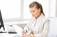 Picture of businesswoman with notebook and calculator