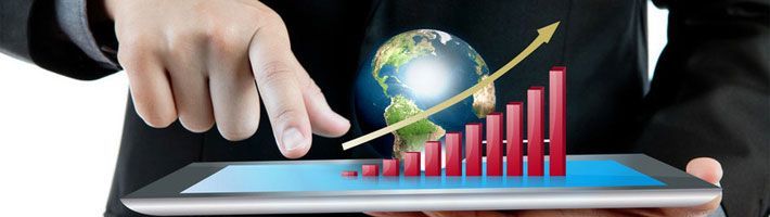 Business man holding the modern digital tablet pc with success growth chart and earth