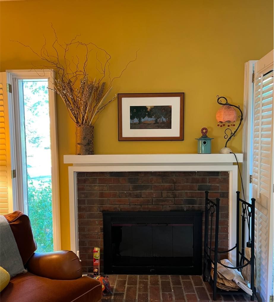 brown fireplace yellow wall