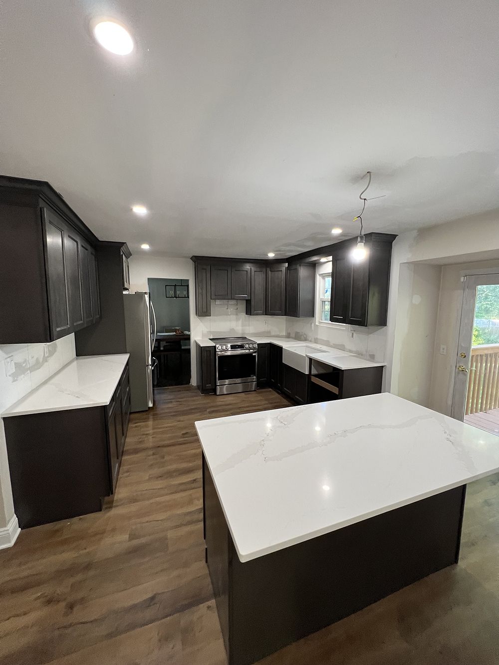 A kitchen with a large island in the middle of the room.