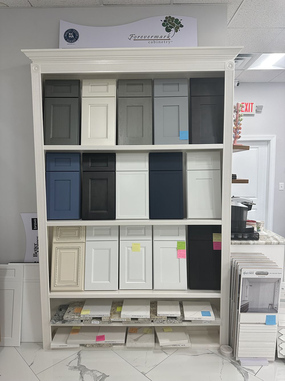 A display case filled with lots of different colored cabinets.