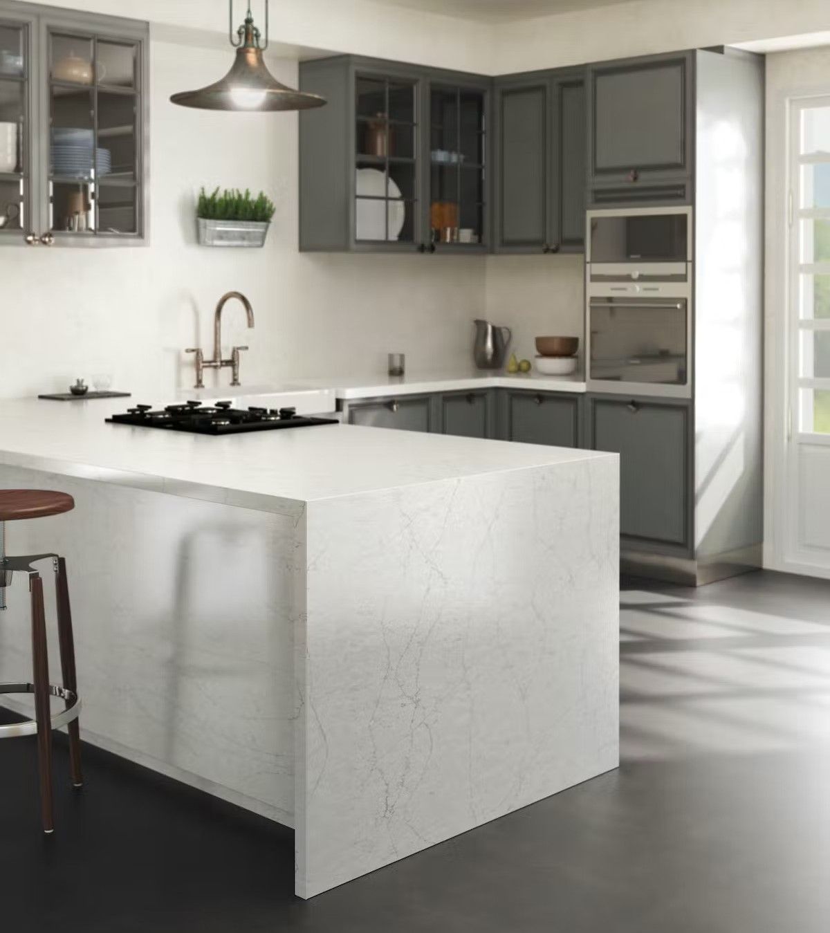 A kitchen with gray cabinets and white counter tops