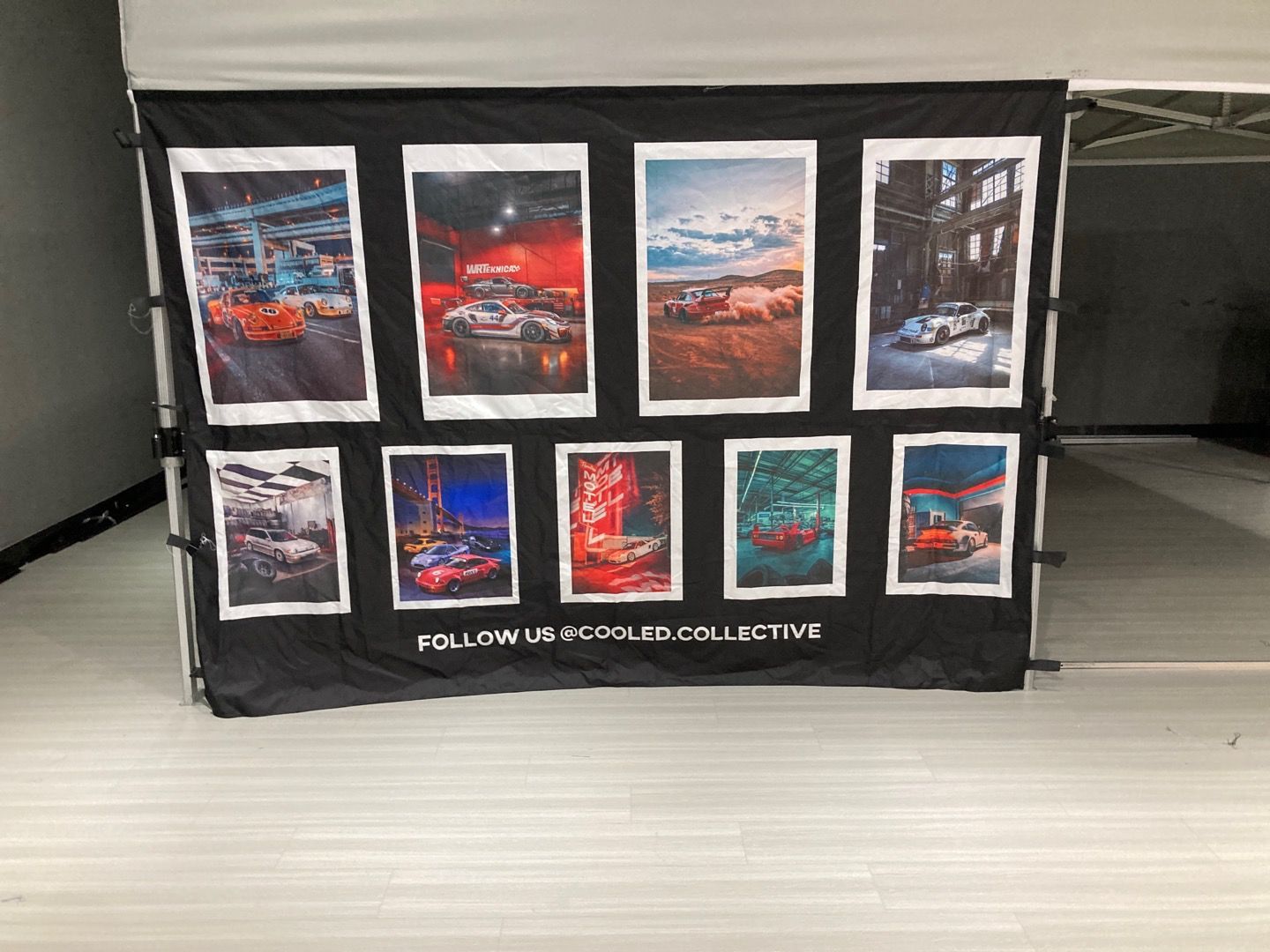 Black banner with nine framed car photos.