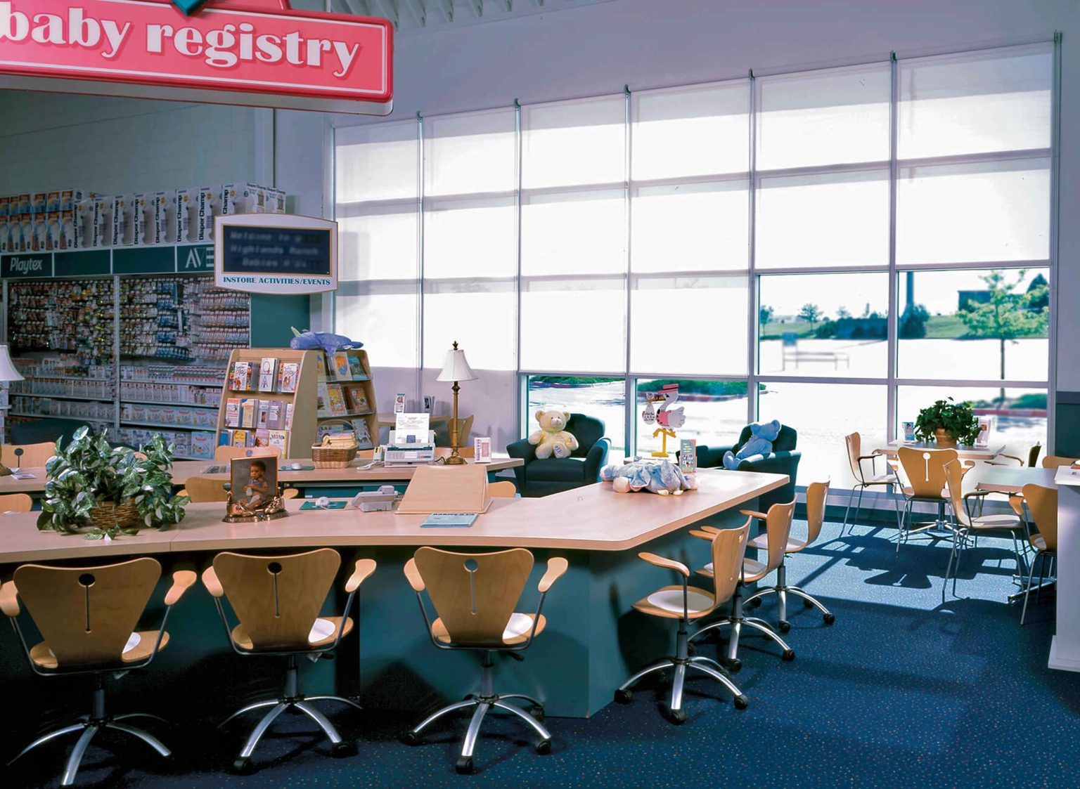 A large room with a baby registry sign above it