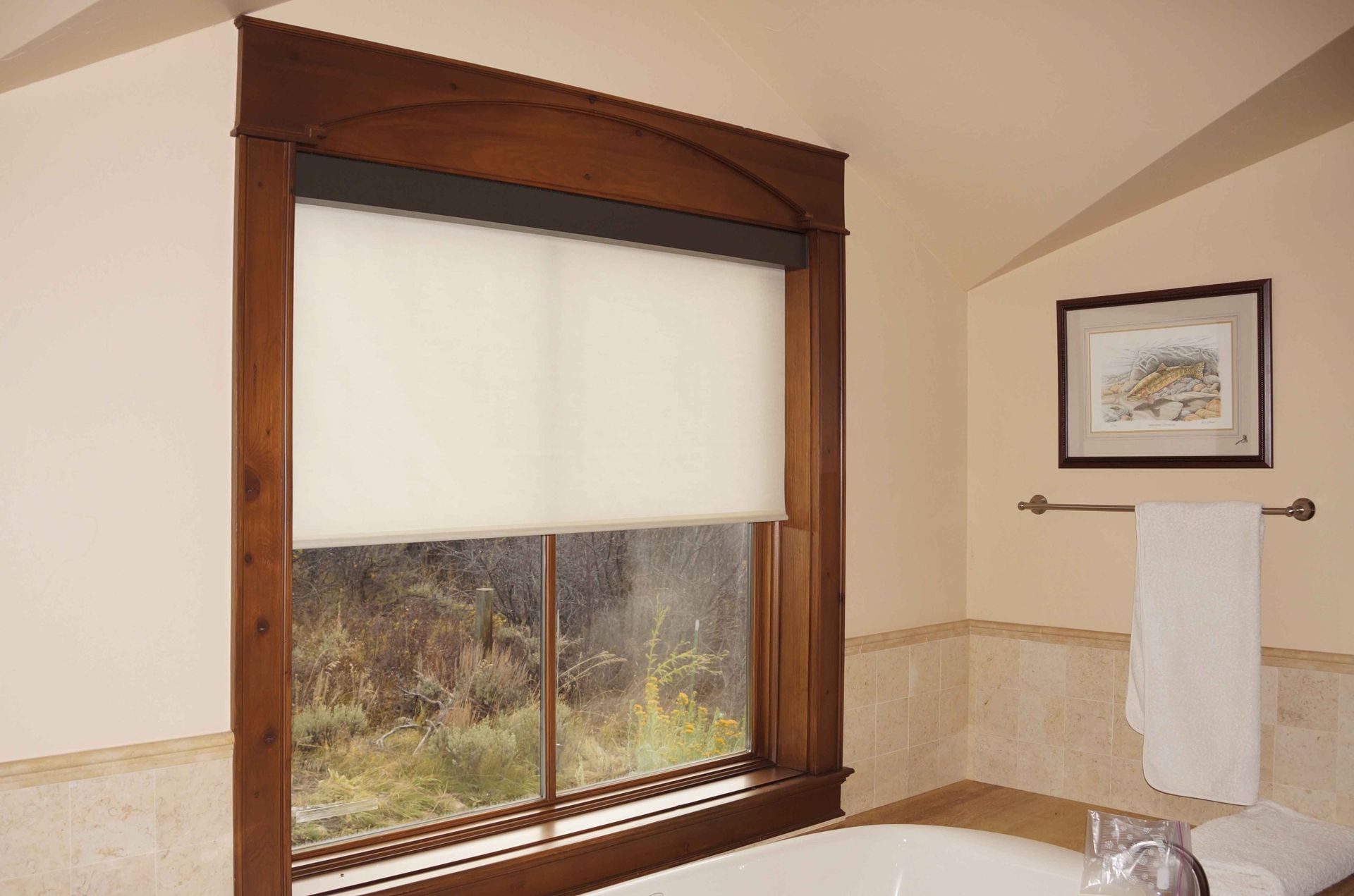 A bathroom with a large window and a bathtub