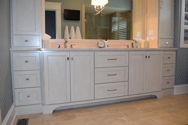 A bathroom with two sinks and a large mirror