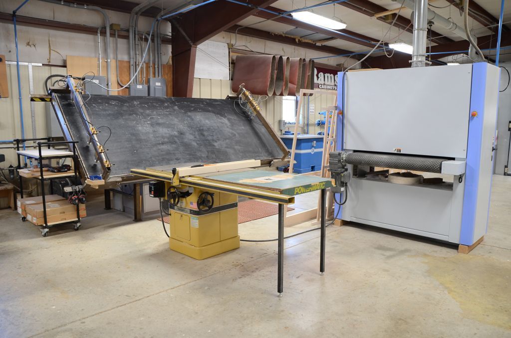 A warehouse with a table and a machine in it