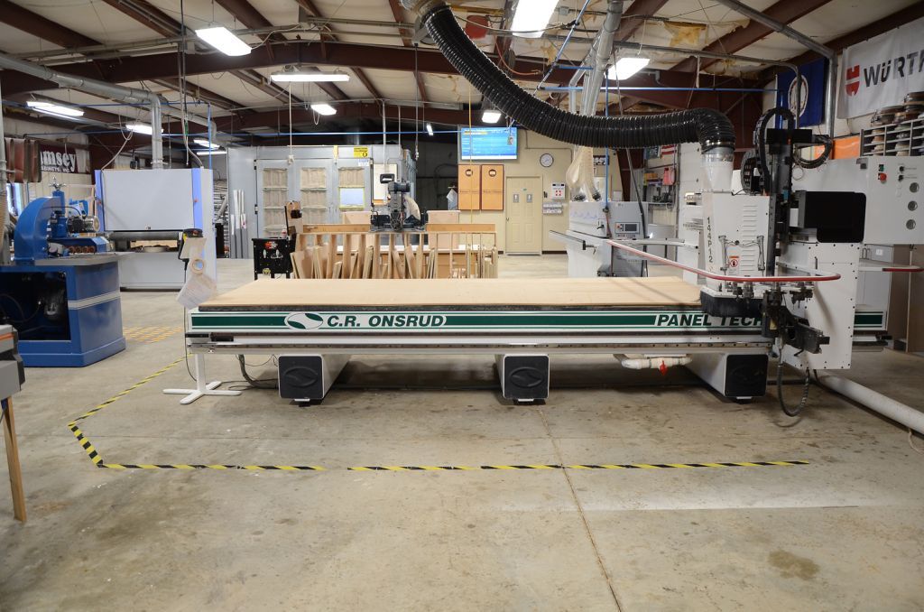 A machine in a factory that says 'T.W. Chicago' on it