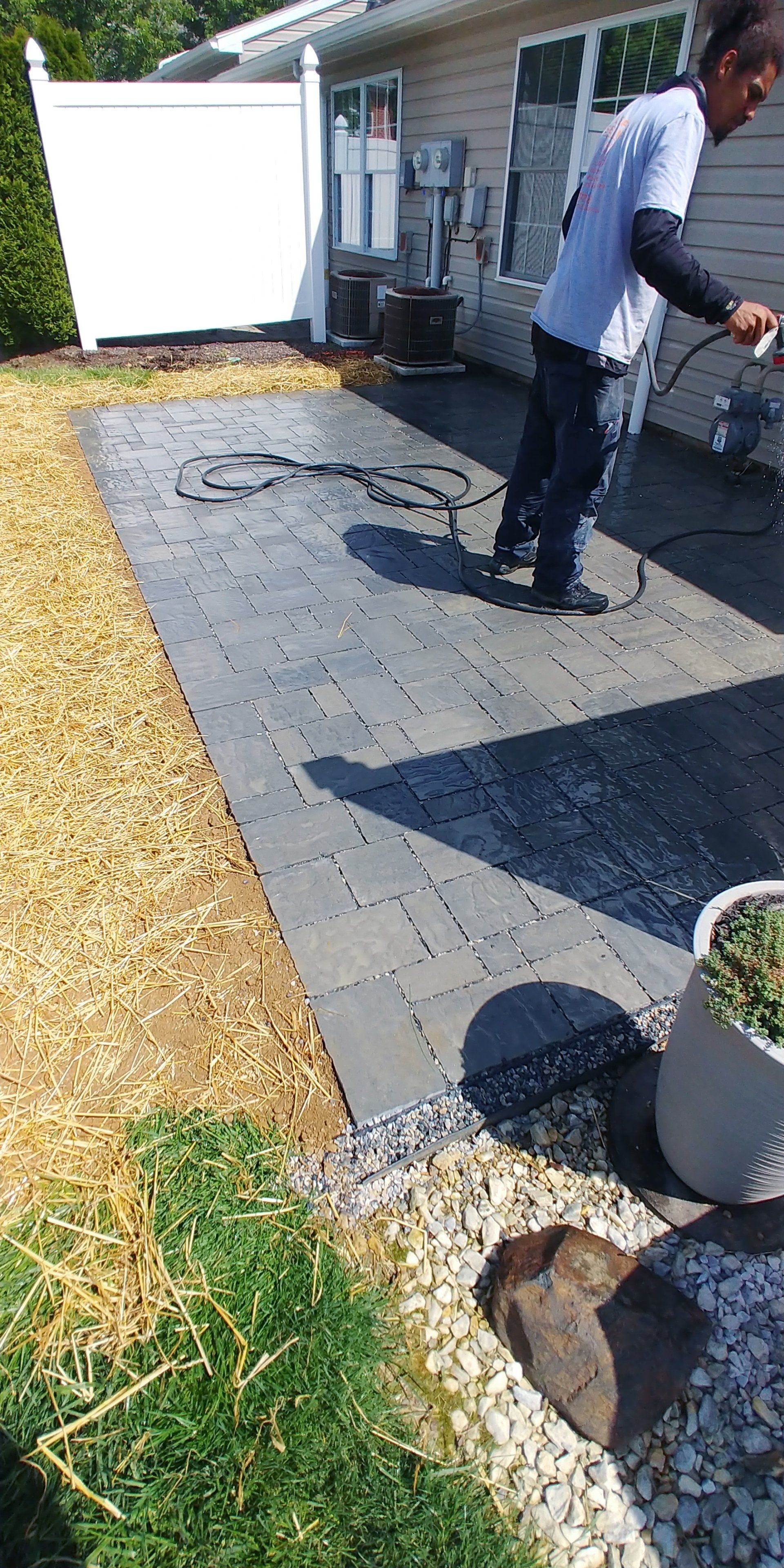 man working on hardscapes