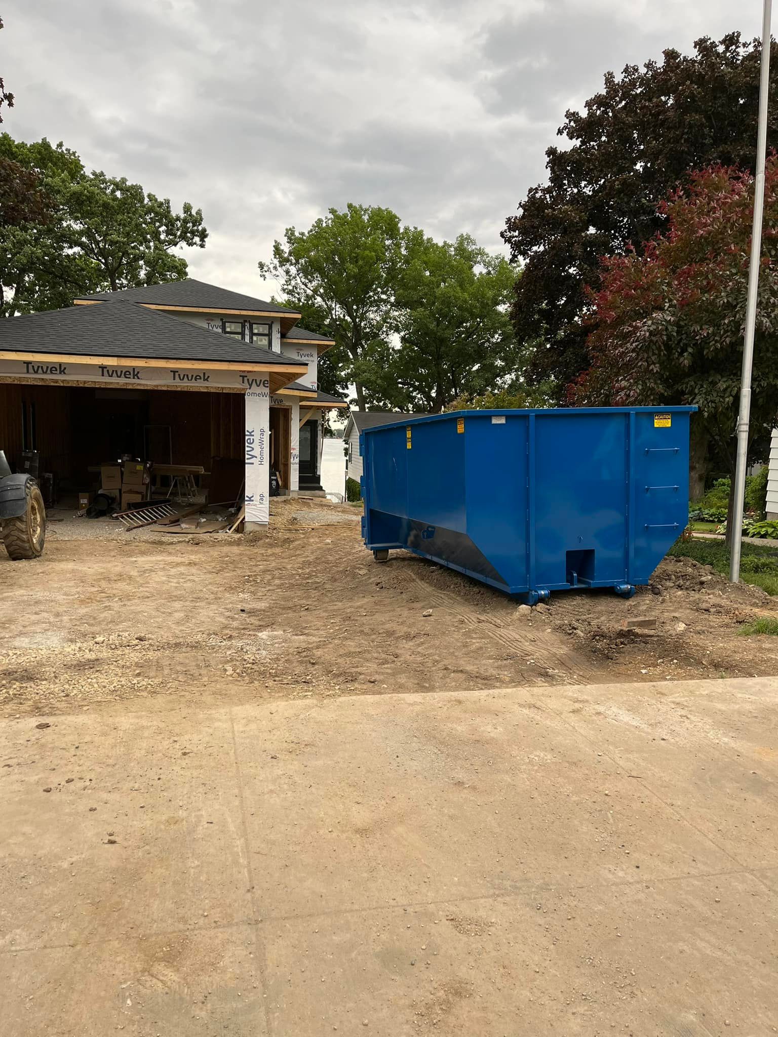 New house with dumpster