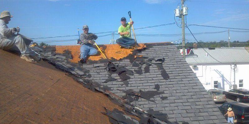 Men repairing a roof