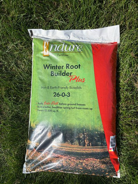 Two bags of Hi-Yield weed stopper, potted plants with yellow daffodils and green leaves.