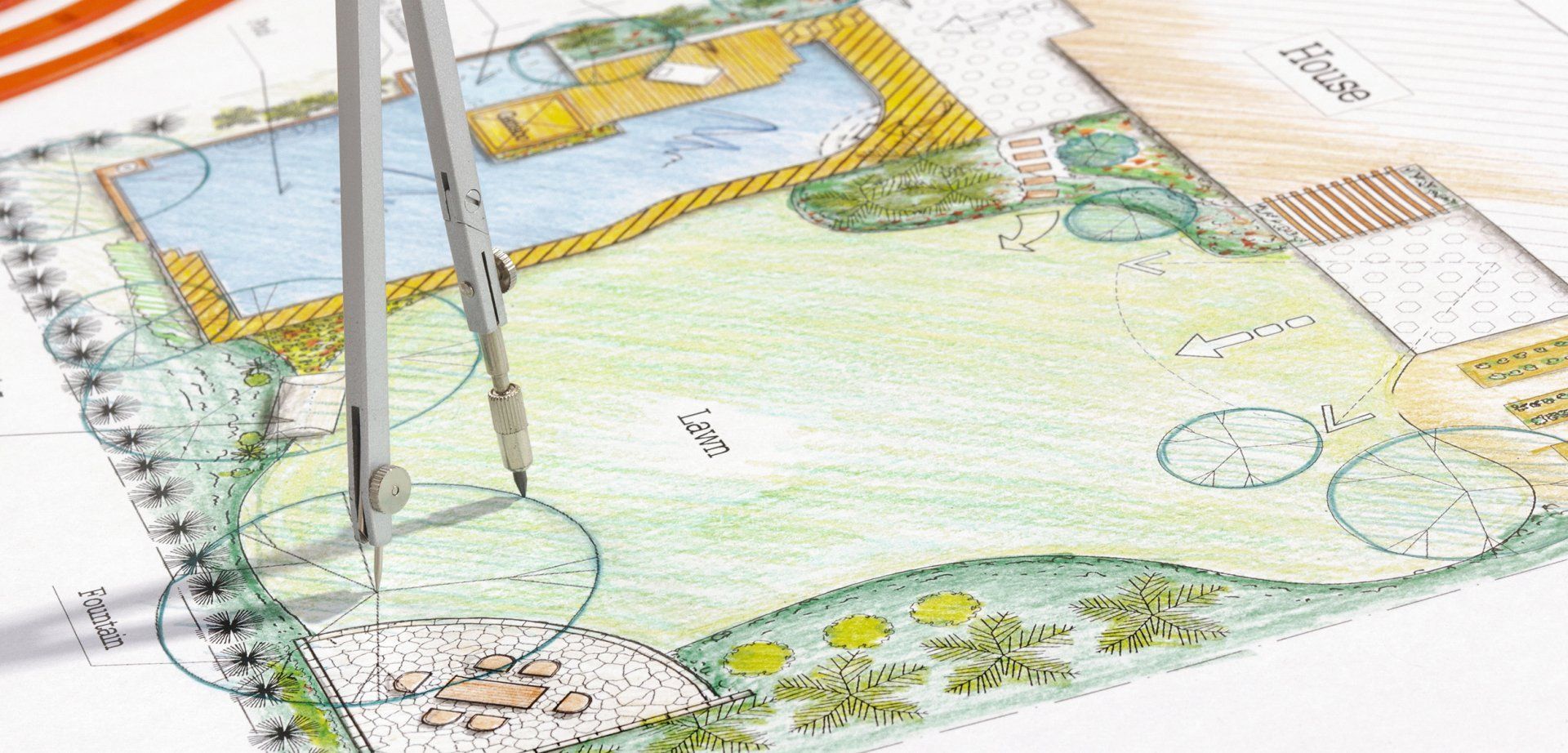 A drawing of a garden with a compass on top of it.