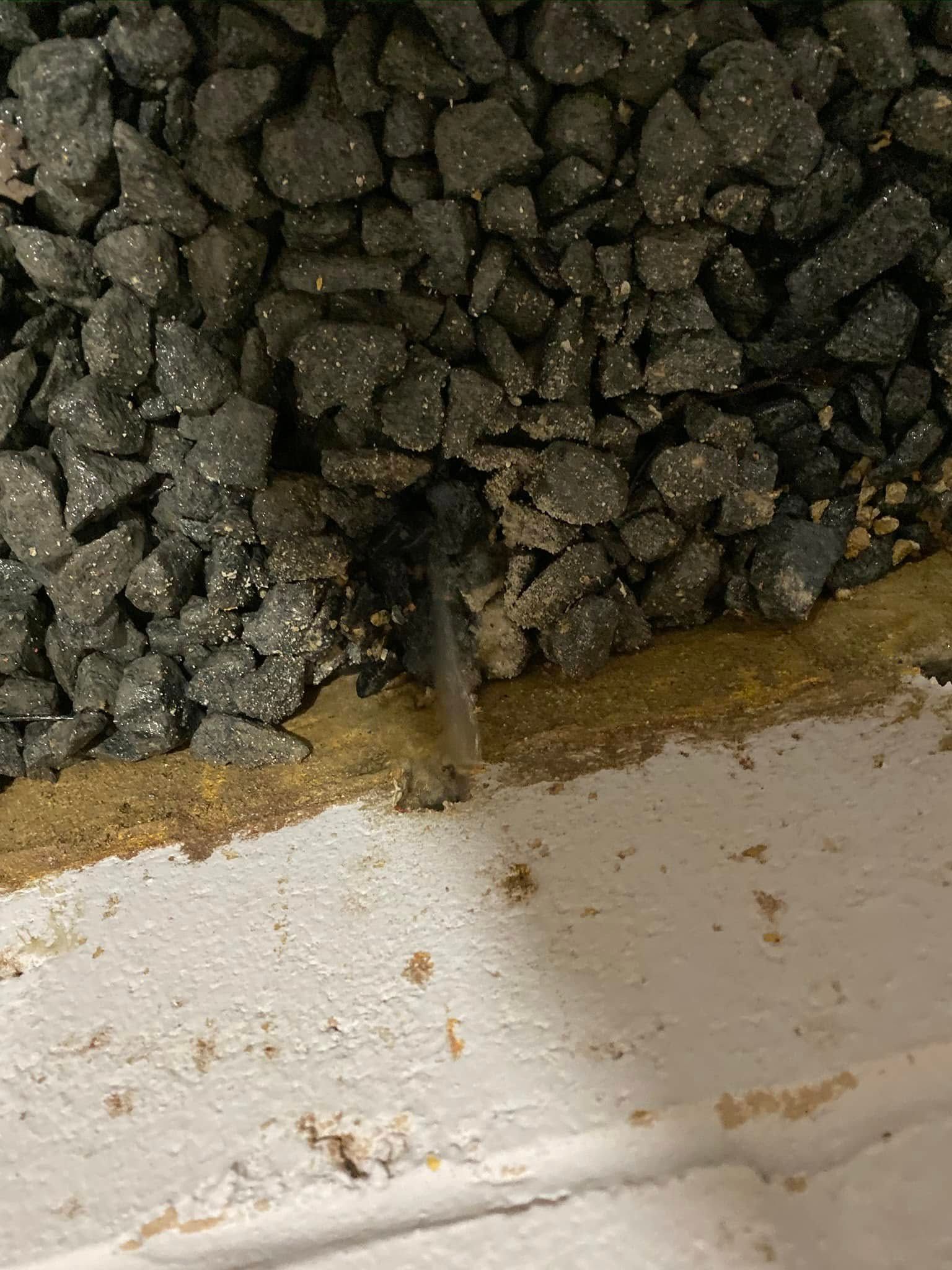 A close up of a pile of rocks on a wall.