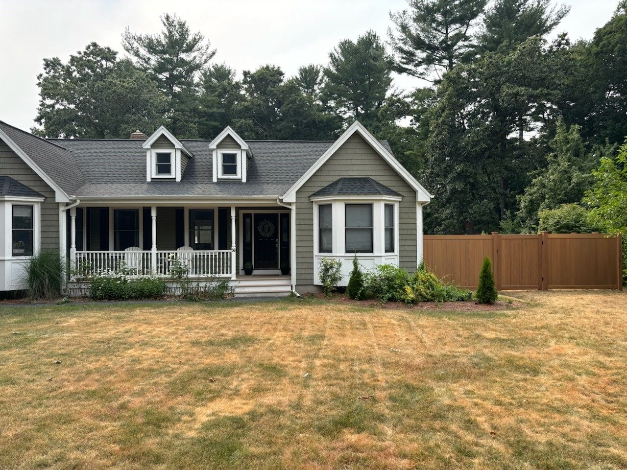 A house with a wooden fence
