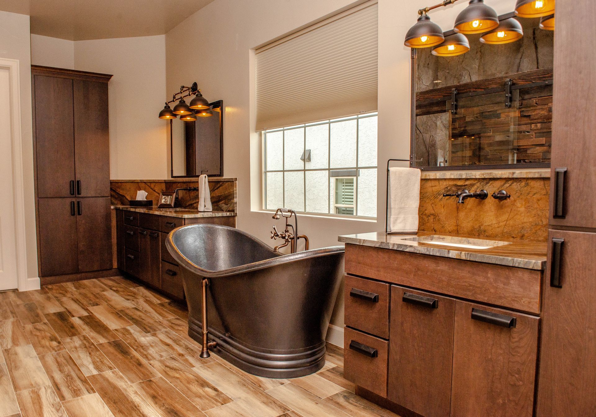 There is a bathtub in the middle of the bathroom.