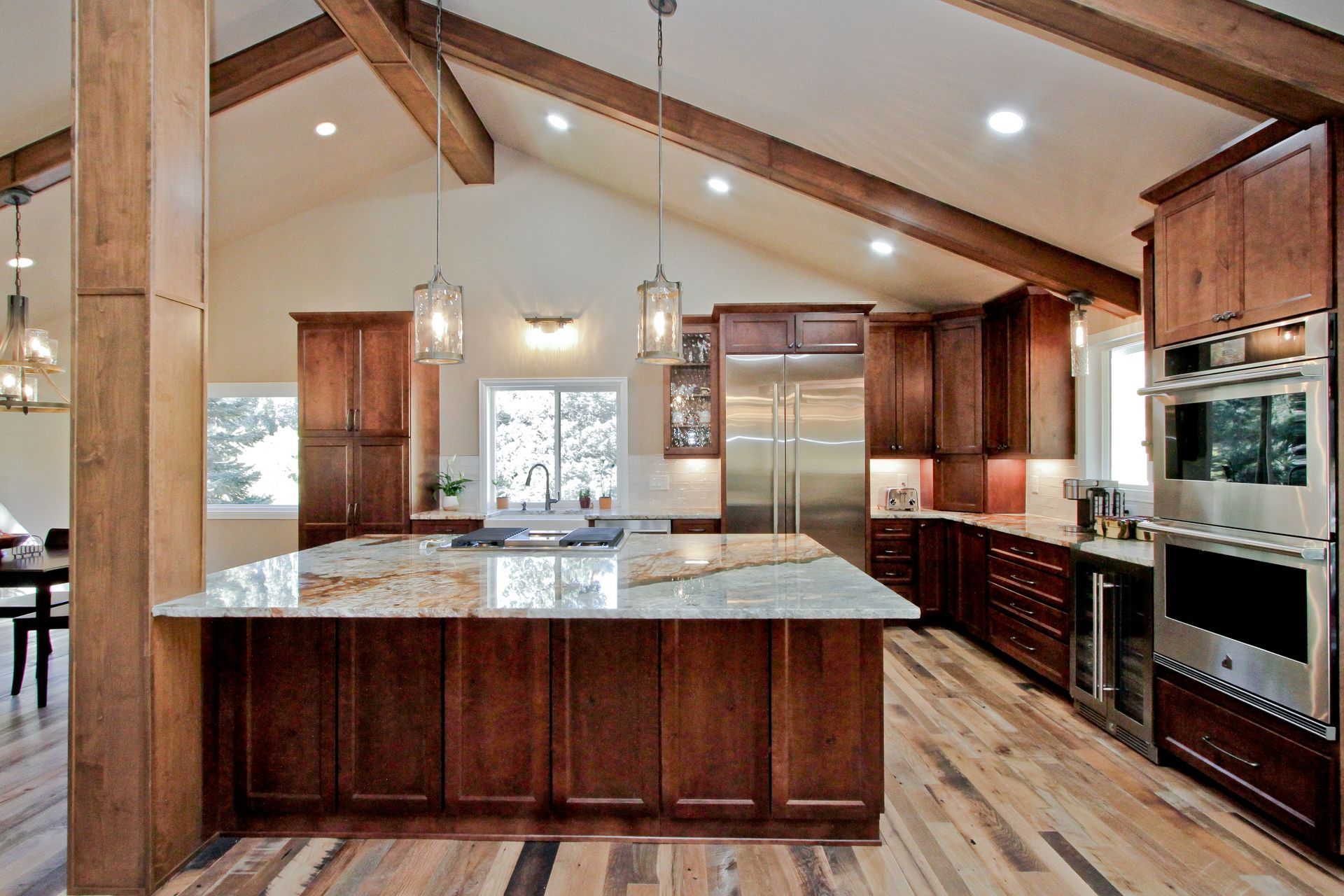 A kitchen with stainless steel appliances and wooden cabinets