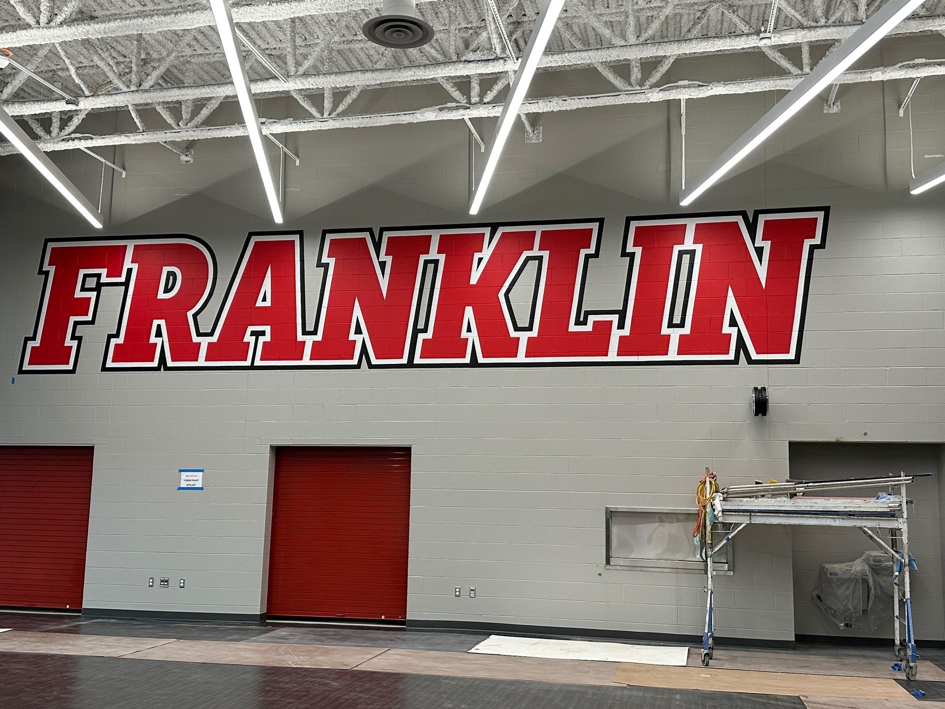 The word franklin is painted on the side of a building