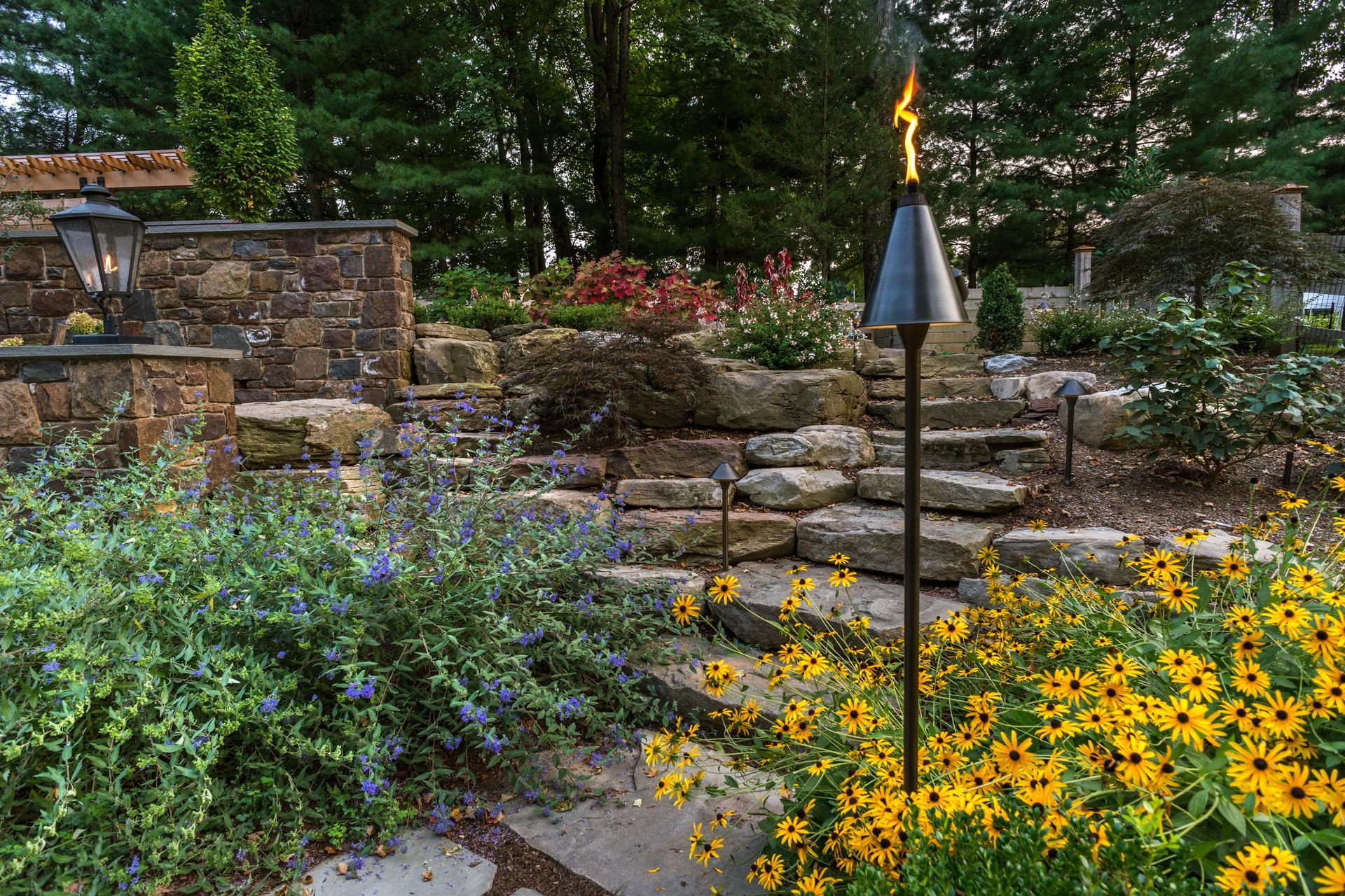 There is a torch in the middle of the garden.