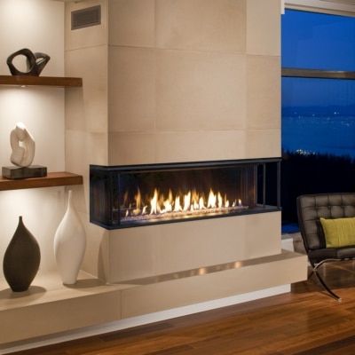 A living room with a fireplace and a couch