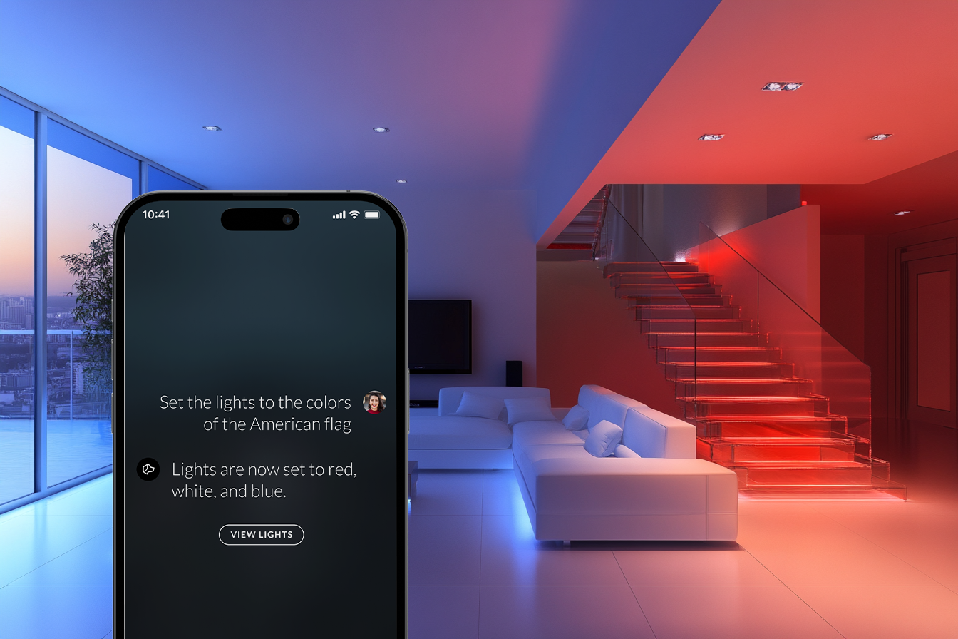 A cell phone is sitting in a living room next to a staircase.