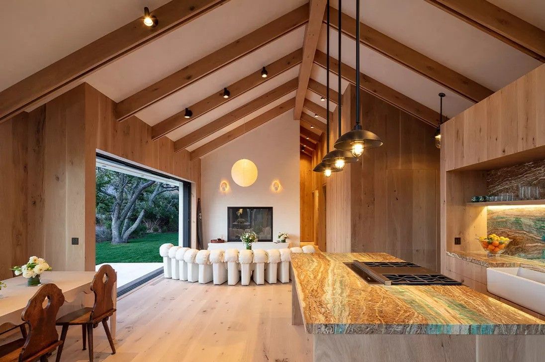 A kitchen with lighting fixtures in the afternoon