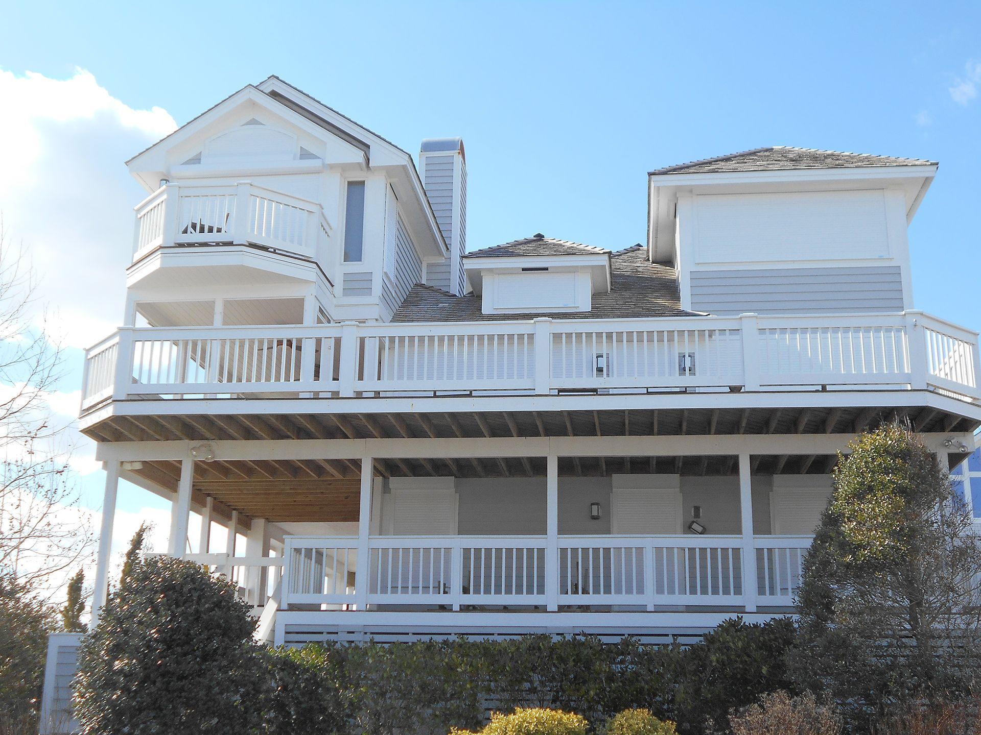 A large white house with a lot of balconies